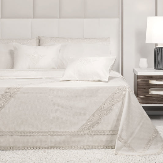 Primo letto bianco in tessuto piquet e pizzo
